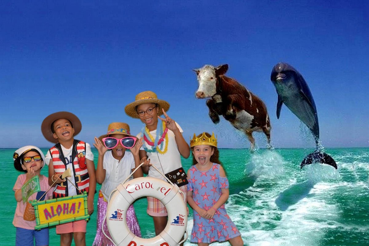 A group of siblings posing with a cow and dolphin.