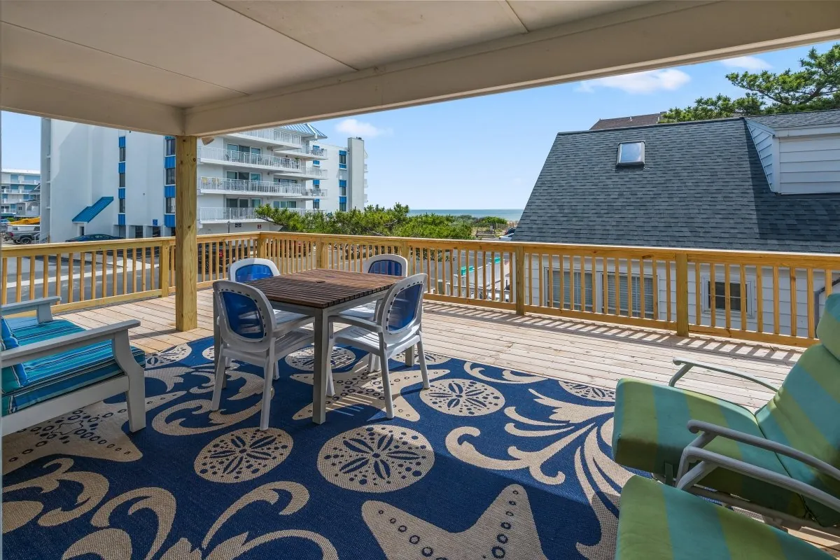 The outdoor deck area with furniture.