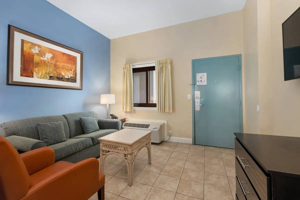 Couch and entry way of a suite at the Coastal Palms.