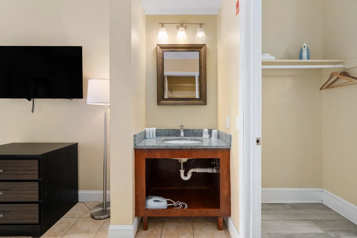 Closet and sink view of suite in Coastal Palms.